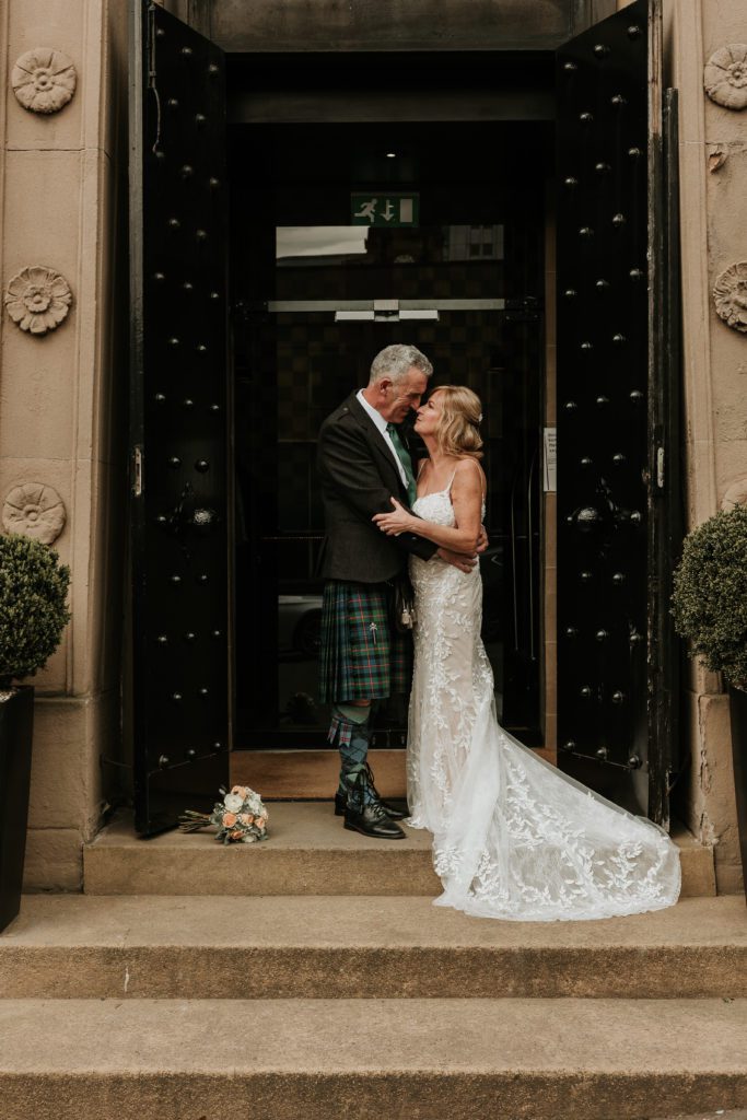 bride and groom outside the Malmaison Glasgow
