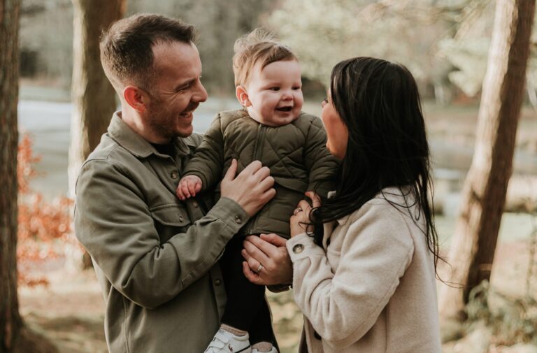 Mum, dad and son in the forrest during their family session